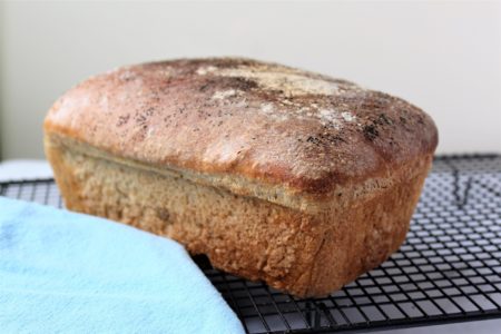 Freshly baked bread cooling on a rack.