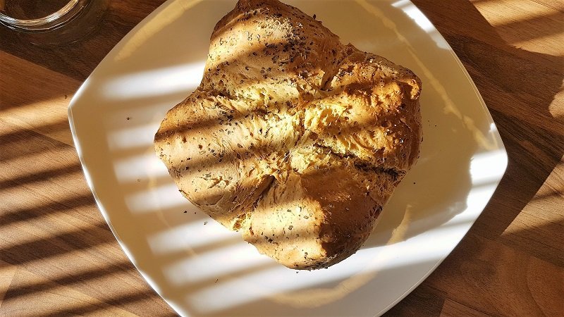 Picture of soda bread with shadows across it.