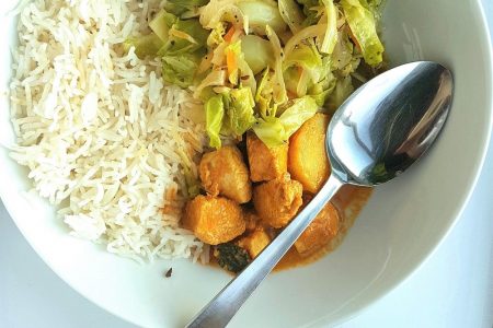 Nyonya Curry Bowl with rice and cabbage.
