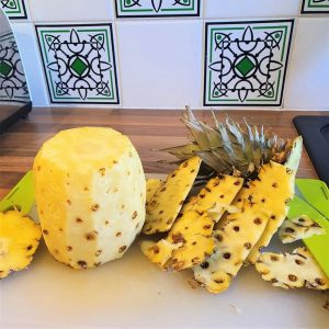 The thorny and prickly skin is cut off.