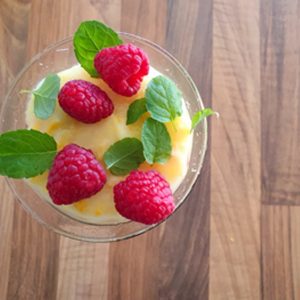 Sweet corn pudding is garnished with fruits