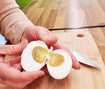 Salted duck egg cut open revealing the lovely yolk.