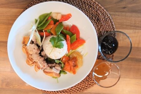 Roast pork served with stir-fry veg