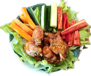 Chicken wings served with crudités