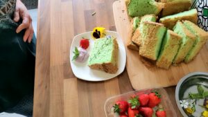 Pandan Chiffon Cake being decorated