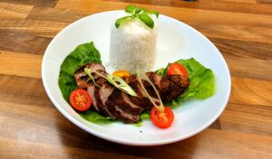 Duck breast serves with rice and salad