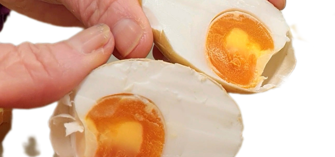 Spiced salted egg cut to show the yolk.