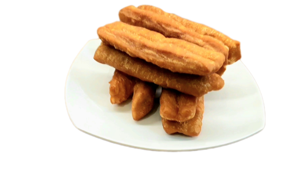 Youtiao or Chinese Fried doughnuts serves on a plate.
