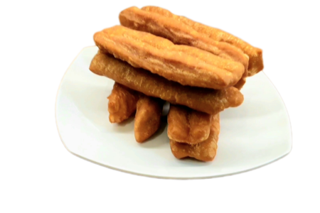 Youtiao or Chinese Fried doughnuts serves on a plate.