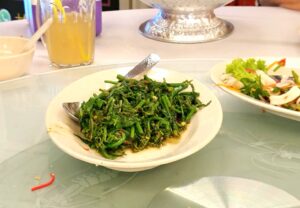 Midin fern stir fried with shrimp paste. And it is hot.