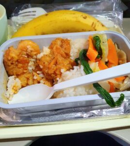 Vietnam Airlines lunch. Shrimp with tangy sauce, served with rice and stir-fried vegetables