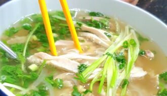 Pho - a noodle soup. Rice noodles with a flavourful stock. with loads of fresh vegetables.