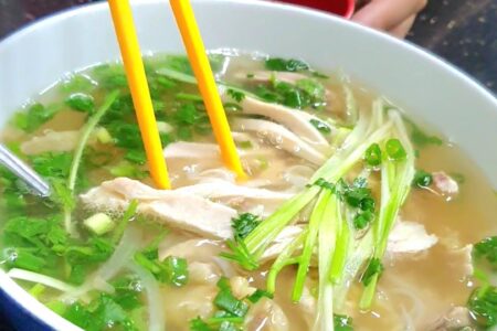 Pho - a noodle soup. Rice noodles with a flavourful stock. with loads of fresh vegetables.