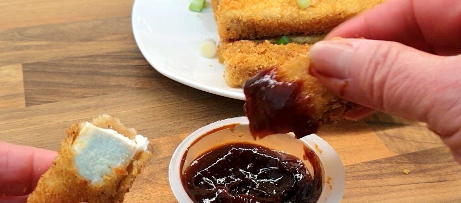 Fried tofu fingers served with BBQ sauce. Sauce is left-overs from take-away.